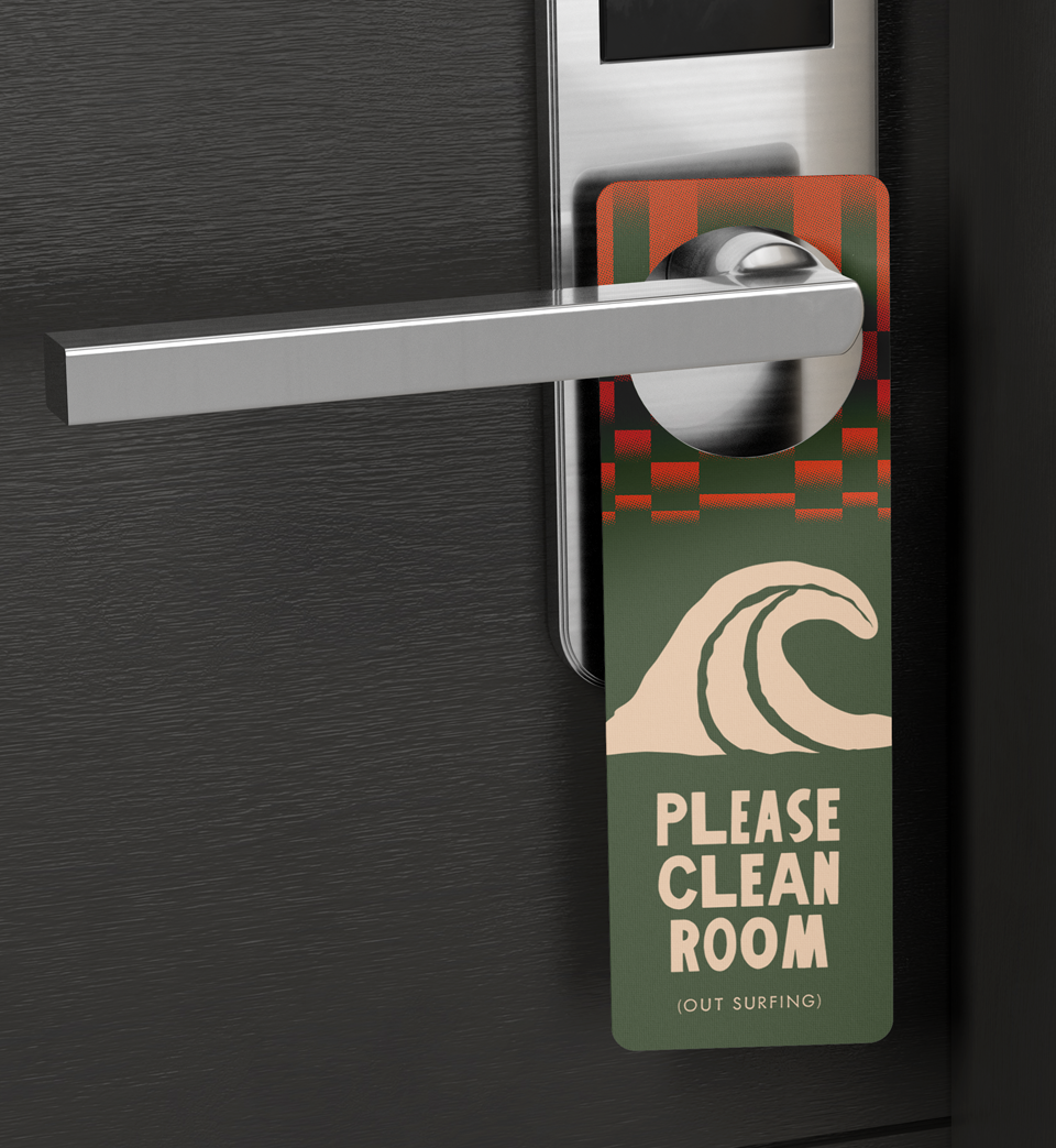 Door hanger reading PLEASE CLEAN ROOM (OUT SURFING) with a wave illustration