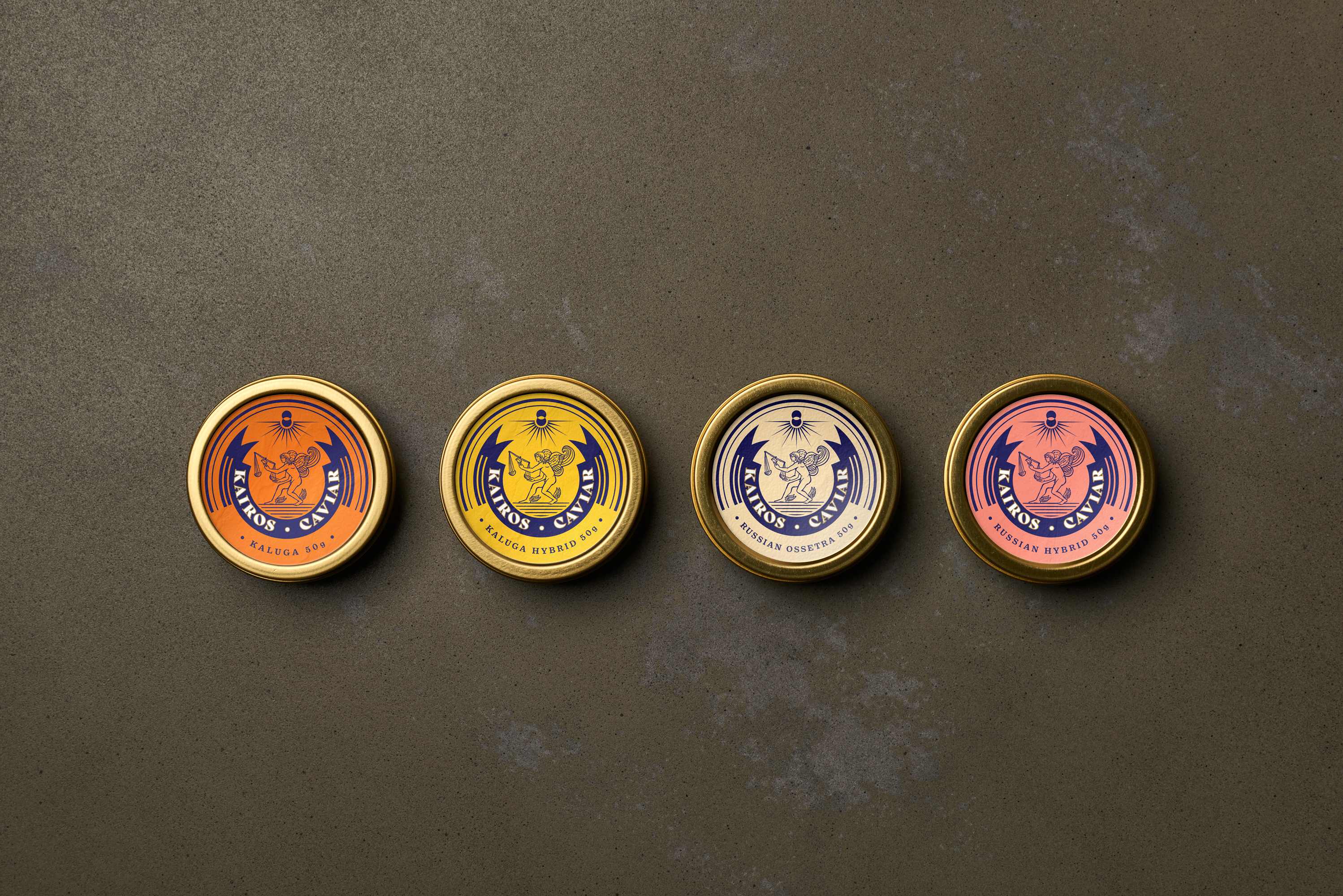 Four gold Kairos Caviar tins in a row — orange Kaluga, yellow Kaluga Hybrid, cream Russian Ossetra, and pink Russian Hybrid labels on a grey concrete surface