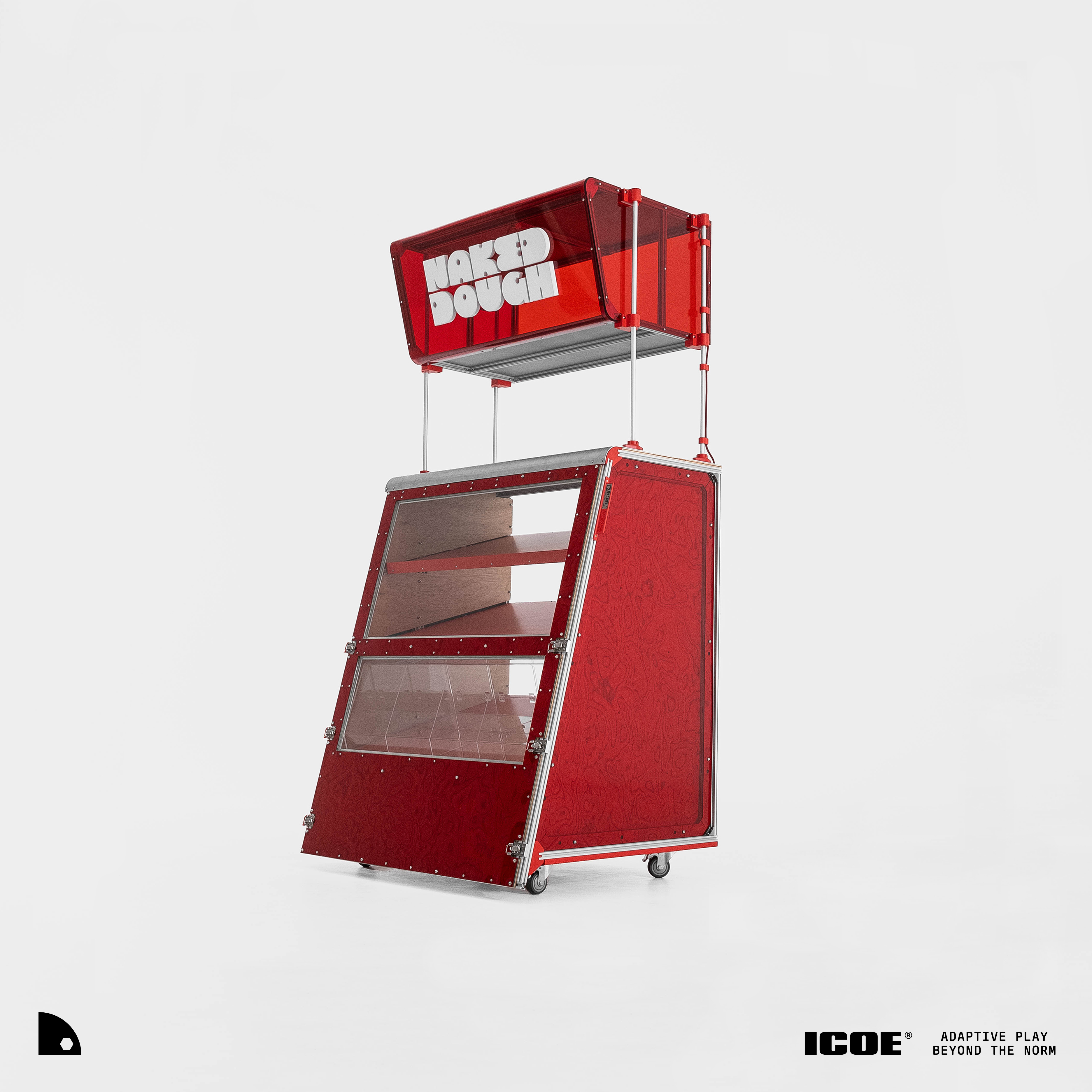 The assembled Naked Dough booth — an illuminated red acrylic NAKED DOUGH header on poles above a trapezoidal red flight-case display cart with an angled glass display front, internal timber shelves, aluminium framing and locking casters