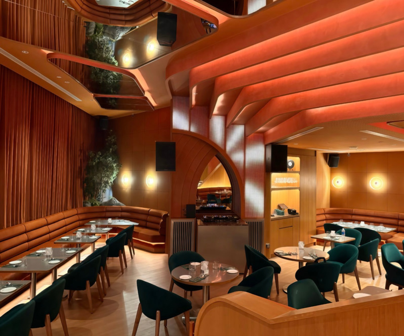Temper Wine Room lounge — sculptural curved terracotta ceiling beams over tan leather banquettes and green velvet chairs